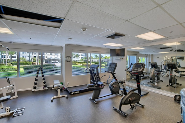 workout area featuring a drop ceiling