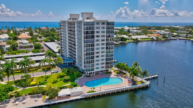 birds eye view of property with a water view