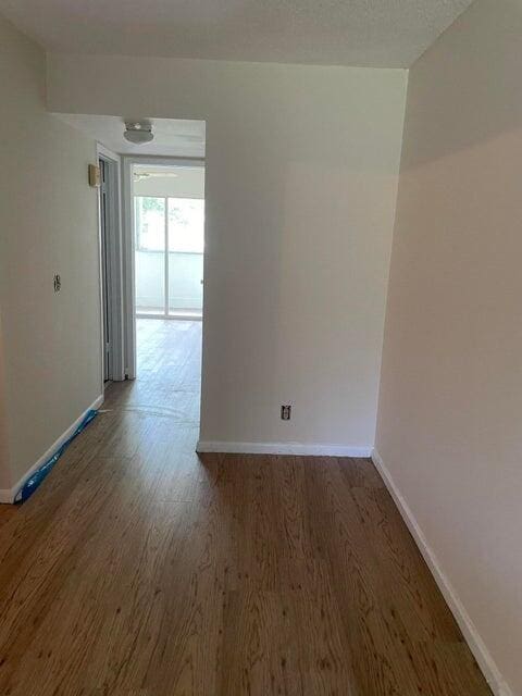 spare room with wood-type flooring