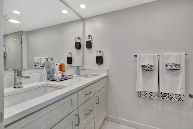 bathroom featuring tile patterned flooring and vanity