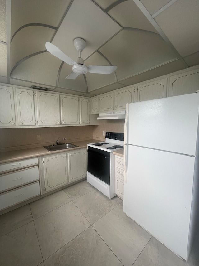 kitchen featuring ceiling fan, sink, light tile patterned floors, and white appliances