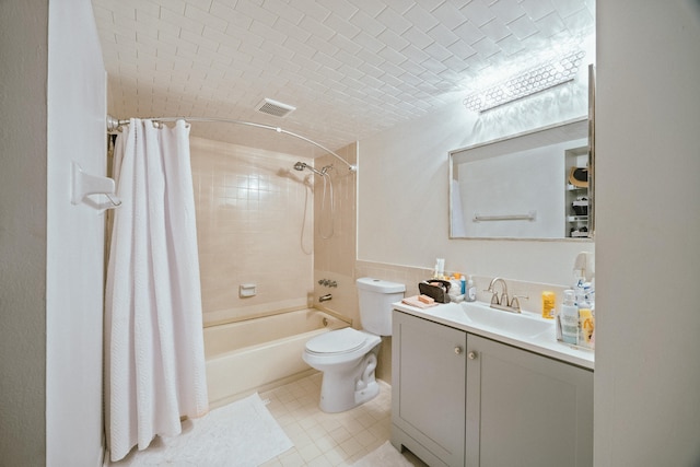 full bathroom featuring shower / bath combo, toilet, tile patterned floors, and vanity