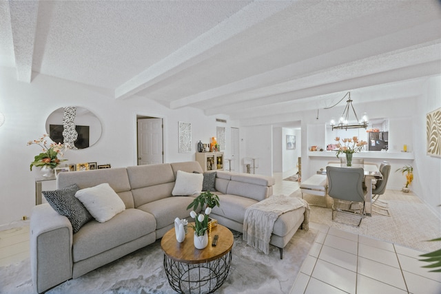 tiled living room featuring beam ceiling, a textured ceiling, and a chandelier