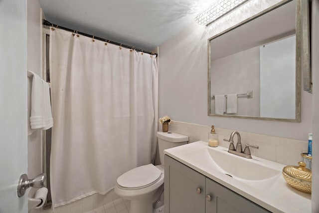 bathroom with backsplash, a shower with shower curtain, vanity, tile patterned flooring, and toilet