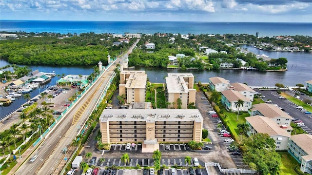 birds eye view of property featuring a water view