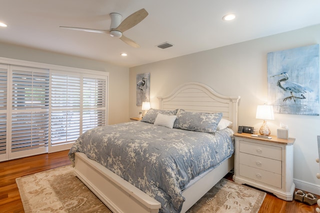 bedroom with wood-type flooring and ceiling fan