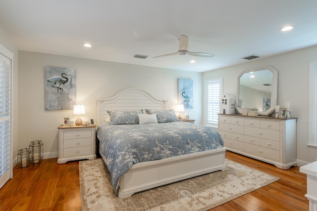 bedroom featuring ceiling fan and hardwood / wood-style flooring