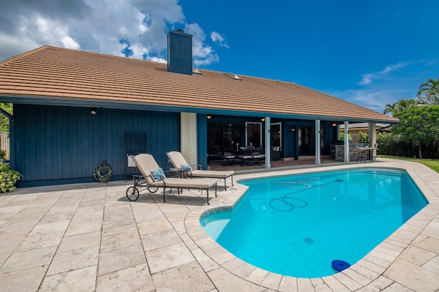 view of swimming pool with a patio area