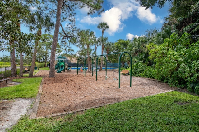 view of jungle gym with a lawn