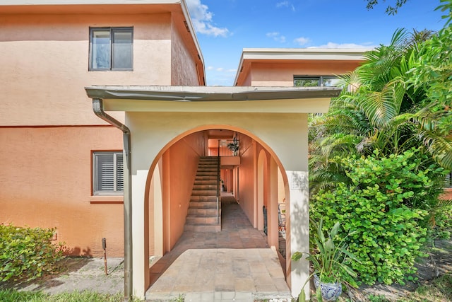 doorway to property with stucco siding