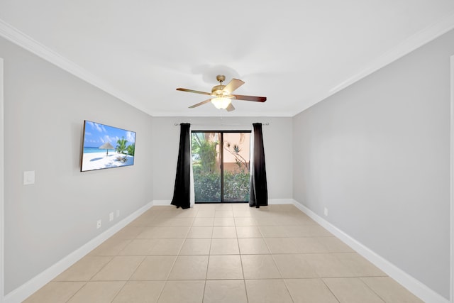 tiled empty room featuring ceiling fan and crown molding