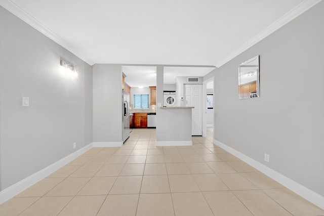 unfurnished living room with ornamental molding and light tile patterned floors