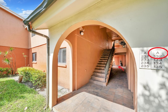 doorway to property with stucco siding