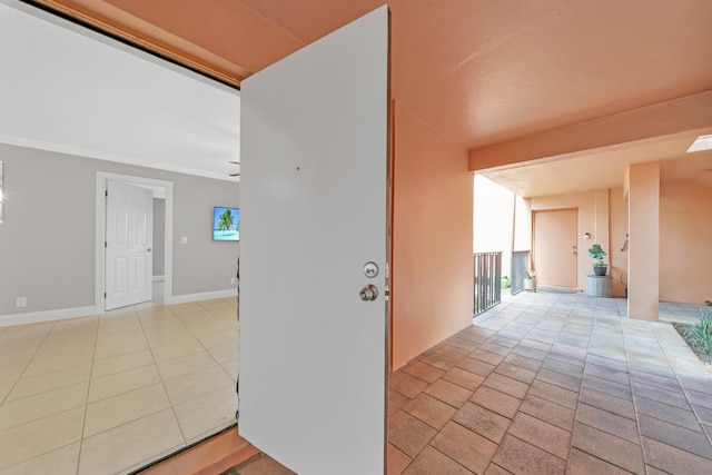 corridor with light tile patterned flooring