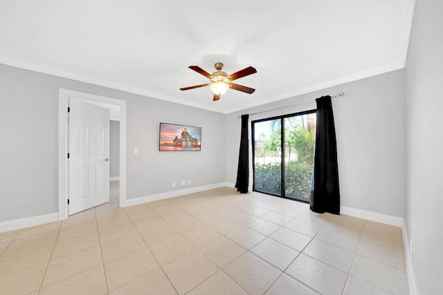 spare room featuring ceiling fan, light tile patterned flooring, and ornamental molding