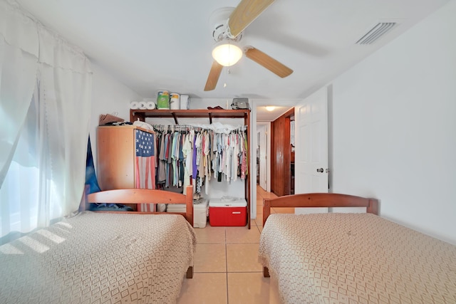 tiled bedroom featuring visible vents and ceiling fan