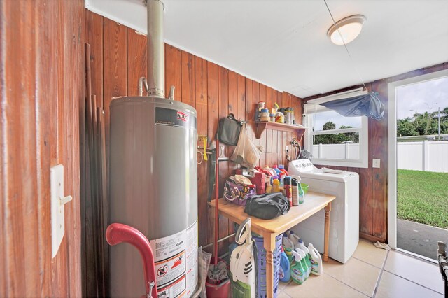 utility room featuring independent washer and dryer and water heater