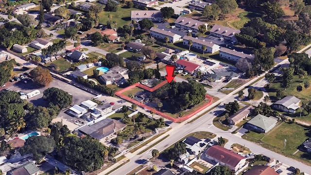 birds eye view of property with a residential view