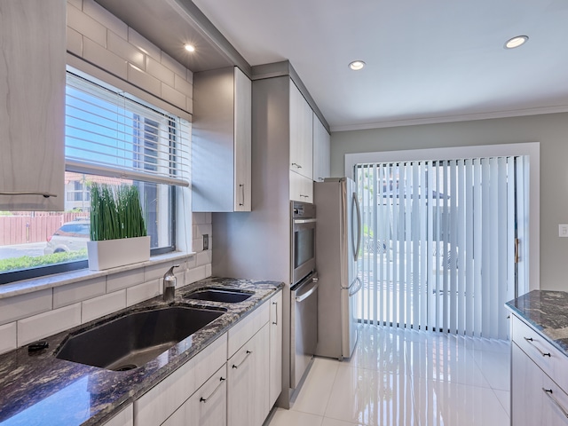 kitchen featuring white cabinets, stainless steel fridge, and decorative backsplash