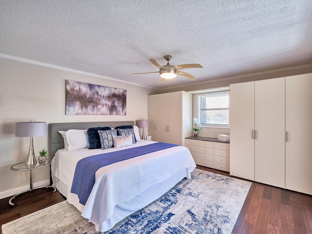 bedroom with dark hardwood / wood-style flooring, crown molding, and a textured ceiling