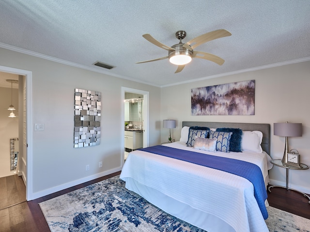 bedroom with connected bathroom, ceiling fan, ornamental molding, and dark hardwood / wood-style flooring