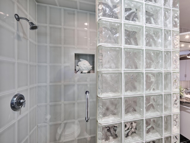 bathroom with a tile shower