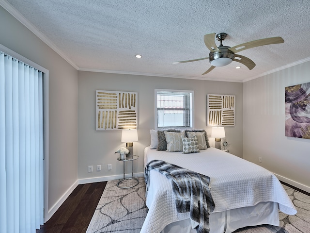 bedroom with ceiling fan, a textured ceiling, ornamental molding, and dark hardwood / wood-style flooring