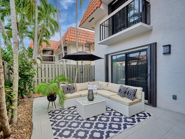 view of patio / terrace with a balcony and outdoor lounge area