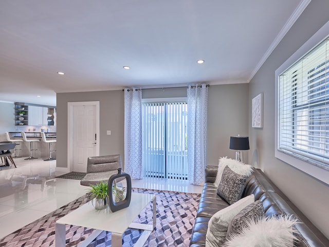 tiled living room with ornamental molding and a healthy amount of sunlight