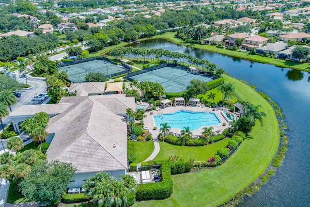 drone / aerial view featuring a water view and a residential view