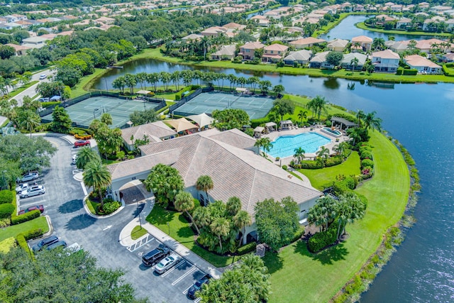 birds eye view of property with a water view