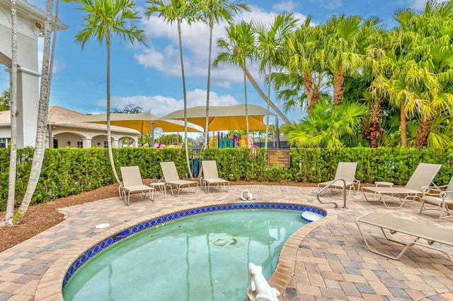 view of swimming pool featuring a swimming pool and a patio