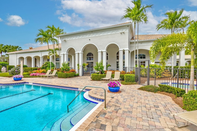 view of swimming pool with a patio