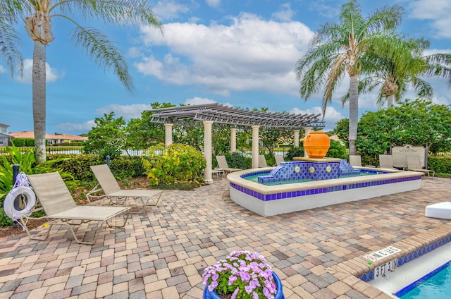 view of patio / terrace with fence and a pergola