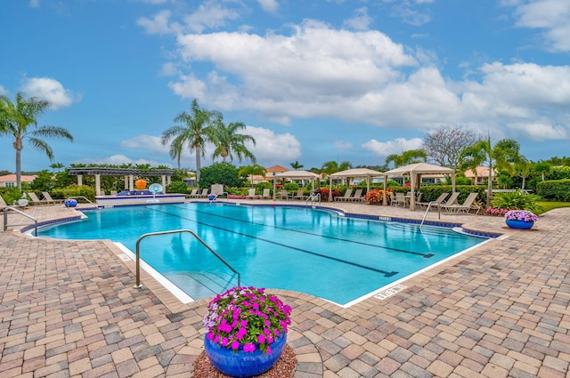 pool featuring a gazebo and a patio