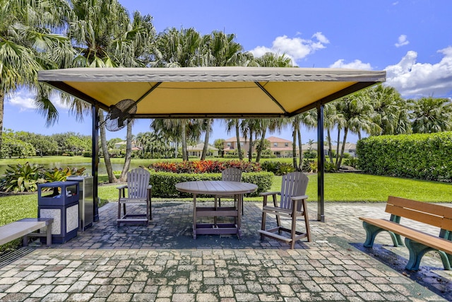 view of community with a yard, a patio, and a gazebo