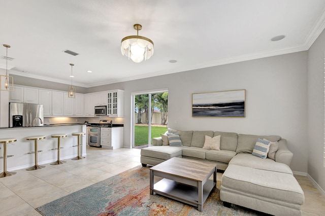 tiled living room featuring ornamental molding, sink, and a notable chandelier