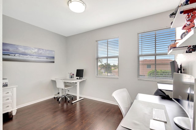 home office with dark hardwood / wood-style flooring