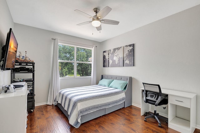 bedroom with ceiling fan and dark hardwood / wood-style flooring