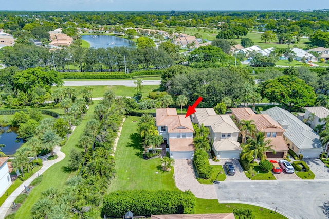 drone / aerial view featuring a residential view and a water view