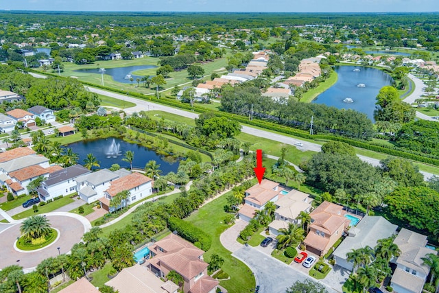 bird's eye view with a residential view and a water view