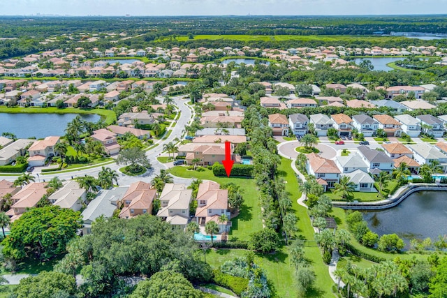 birds eye view of property featuring a water view