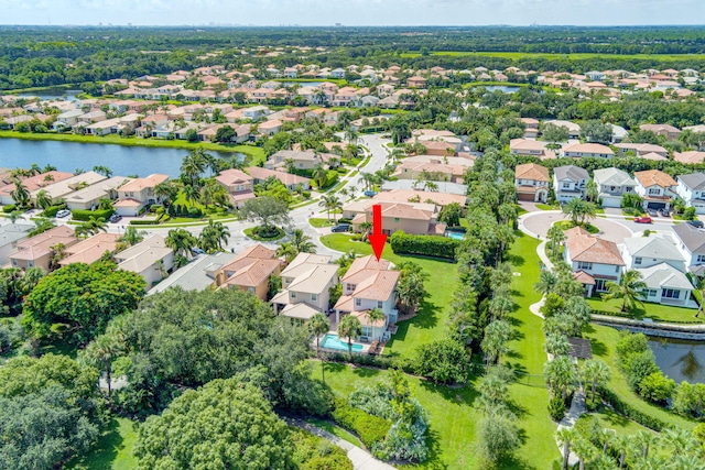 birds eye view of property featuring a residential view and a water view