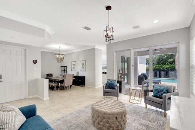 living room featuring light tile patterned floors, ceiling fan with notable chandelier, and ornamental molding