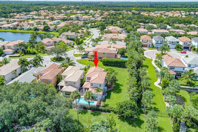 birds eye view of property with a water view