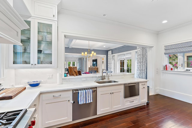 kitchen with white cabinets, sink, stainless steel dishwasher, dark hardwood / wood-style flooring, and a chandelier