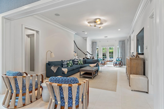 living room with ornamental molding and light tile patterned floors