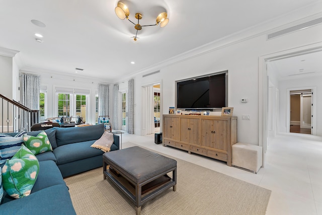 living room featuring light tile patterned floors and crown molding