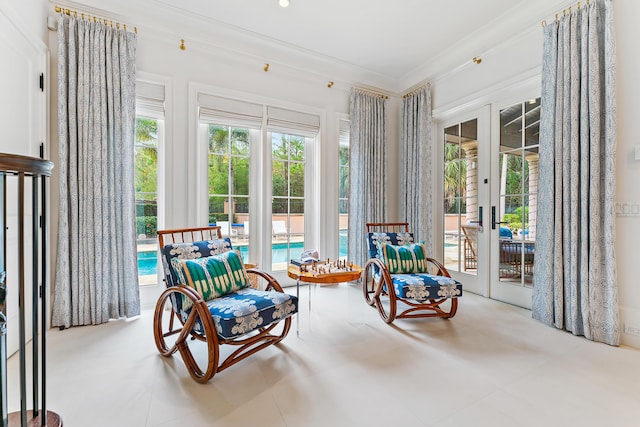 sunroom / solarium featuring french doors