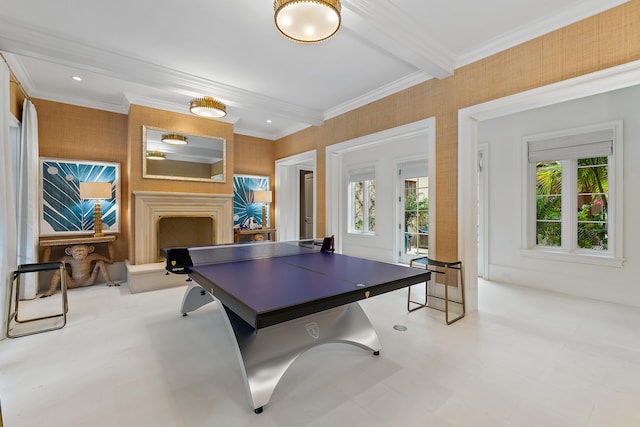 rec room featuring beam ceiling, a wealth of natural light, and crown molding